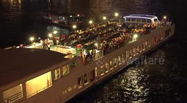The very busy Chao Phraya river at night, in Bangkok, almost as busy as the streets.