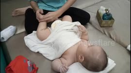 Adorable baby relaxing in spa like a boss