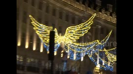 The Regent Street Golden Angels with Paradise theme by a busker