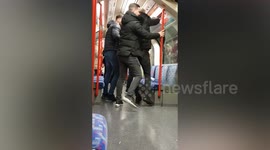 Watch shocking moment woman SMASHES bottle on London tube - showering passengers in shards of glass
