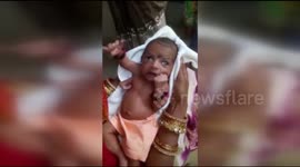 Baby being worshipped as god after being born with three hands