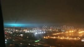 View from flight shows eerie blue grow lighting up New York City sky after transformer explosion