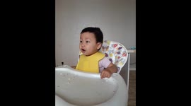 Speaking funny baby on her table
