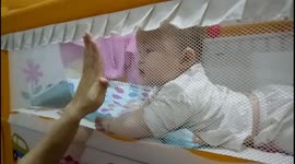 This cute baby knows to HIGH FIVE