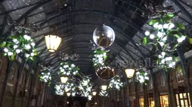 Covent Garden Piazza looks enchanting with a falling snow projection over Christmas