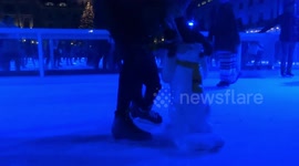 Kids are learning to skate helped by Polar Bear stabilisers at Somerset House Ice Rink