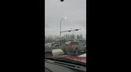 Hundreds of trucks roll through northwestern Alberta city in support of 'yellow vests' movement
