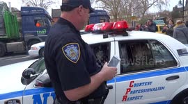 Playing a prisoner locked behind bars inside NYPD car at London New Year Day Parade 2019