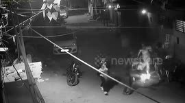 Shocking moment man shoots at woman outside her home