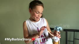 Little girl with Fashionista Barbie doll