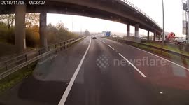 Car pushed sideways by truck