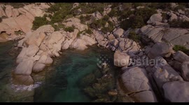 Aerial, Sardinia island and its rocky shore with mediterranean vegetation and beautiful emerald sea