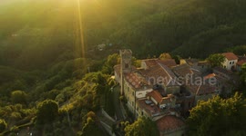 Aerial, an ancient small perched hamlet on sunset in Tuscany, Italy