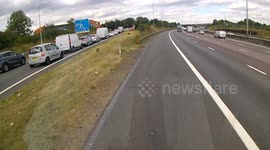 Dash cam footage shows lorry almost causing major accident on busy UK motorway