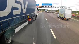 Dash cam footage shows lorry almost causing major accident on busy UK motorway