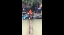 The challenge ride a bike through the small footbridge in the lake