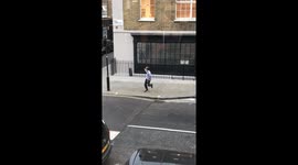 Man in London's Soho dances enthusiastically all by himself