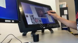 Time lapse of worker on touch screen with stylus