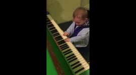 Baby playing piano