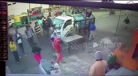 Lucky escape for 50-year-old woman as garbage truck reverses over her