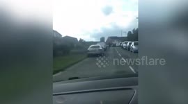 Motorist knocks cyclist off his bike in dangerous prank