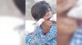 Bizarre moment man feeds his pet pigeons from his mouth in India
