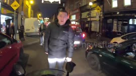 Angry boyfriend chases biker after revving at jaywalking girlfriend