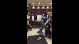 Four men brawl inside London chicken shop and use cleaning sign as makeshift weapon