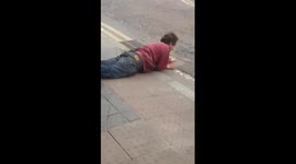 Man falls over before shouting at pedestrians in Belfast
