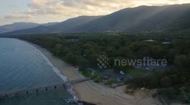 Aerial, beautiful seascape and a  pier and beach with tropical vegetation in Palm Cove, Queensland, Australia