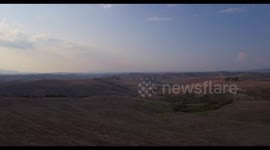 Aerial, gorgeous plowed fields landscape in Tuscany