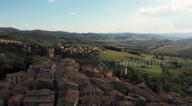 Aerial, little medieval town in Tuscany, San Casciano dei Bagni, Italy on a sunny day
