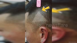 Barber accidentally shaves 'play button' on man's head