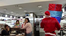 Santa 'drops' presents on people in holiday prank