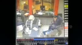 Bank staff terrified by cat randomly falling from the ceiling