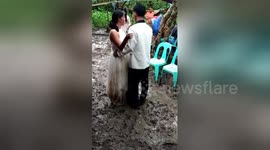 Newlyweds have 'muddy' first dance in typhoon-hit village