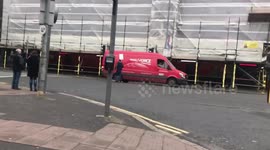 Near miss: Protester walks into moving traffic before pedestrian pulls him aside