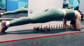 Woman does plank over dozens of lipsticks to get motivation