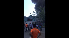 The wood factory caught fire creates huge black smoke pillar rose