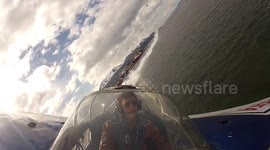 Daredevil pilot flies his aircraft between two boats in Argentina airshow