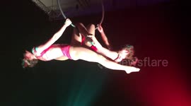 Circus arts performing double act on the Aerial Hoops