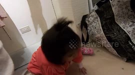adorable girl is having fun at the department store as a playground