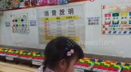 adorable girl first time playing the shooting ball very professional.