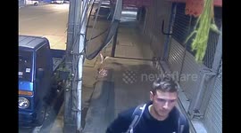 Backpacker tourist caught on CCTV spray-painting tag on shops in Thailand
