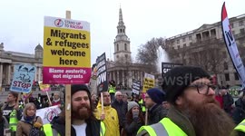 Britain is Broken Yellow Vests protesters chant Macron Demission! Theresa May Must Go! in Trafalgar Square - London