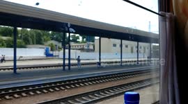 Train leaving station with music