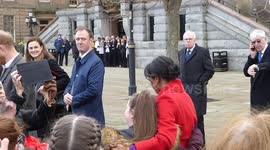 Meghan and Harry cuddle crying schoolgirl on first joint engagement of 2019