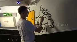 Artist Sebastian Chaumeton aka SCARTWURK starts painting a new mural at ArtRooms Fair 2019 in London
