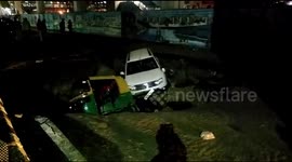 Road collapses outside Delhi metro station, trapping two cars