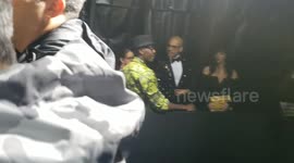 Don Cheadle waiting to walk the Black Monday Carpet